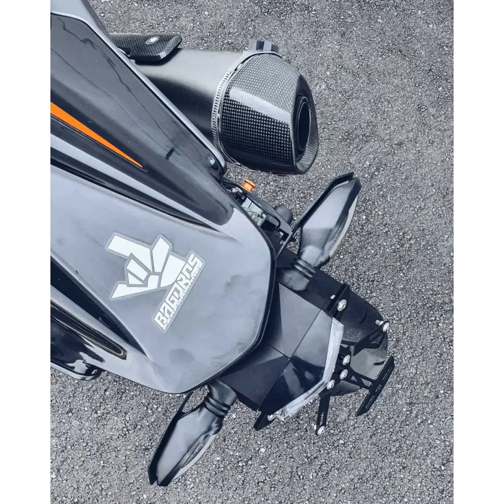 Sleek black KTM Duke motorcycle with a gray saddlebag showcasing Bagoros Performance Kule