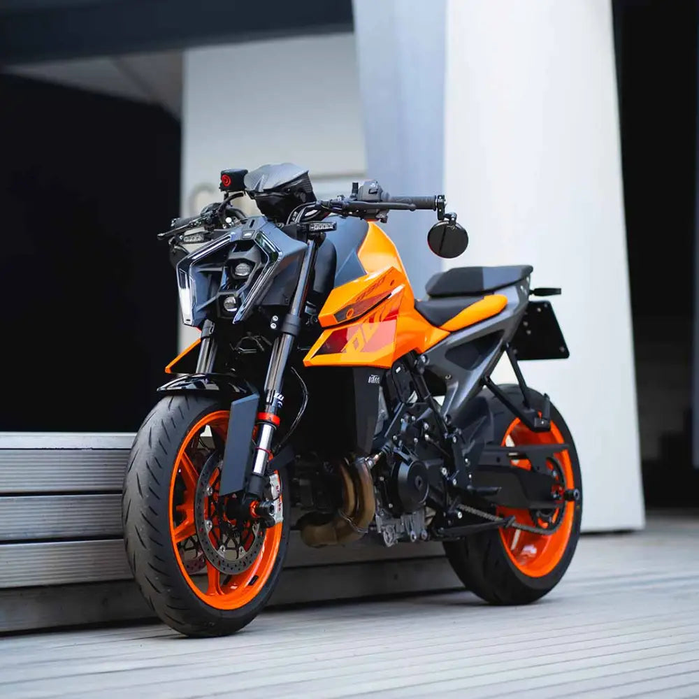 Sleek orange and black KTM Duke motorcycle showcasing Tail Tidy Premium plug and play design