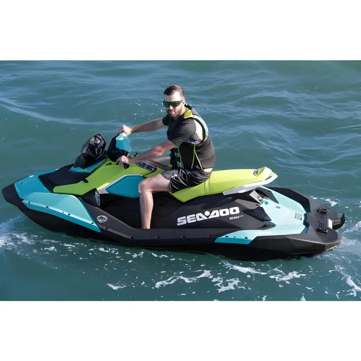 Sea-Doo personal watercraft in turquoise and black displayed with Bluetooth stereo