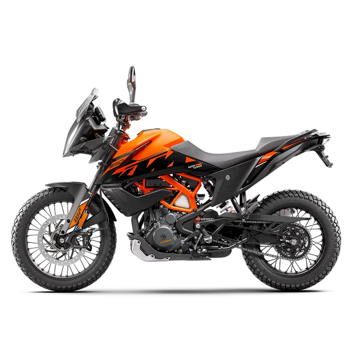 Orange og svart KTM 390 Adventure motorsykkel med dual-sport dekk i 2024-modell