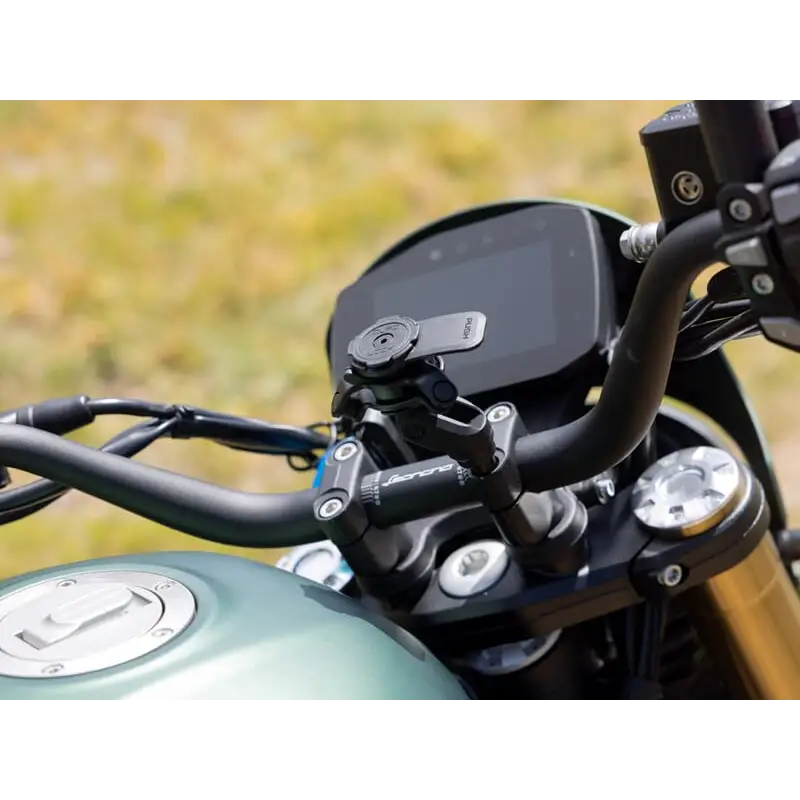 Motorcycle handlebar with Quad Lock Handlebar Clamp Mount Pro phone holder