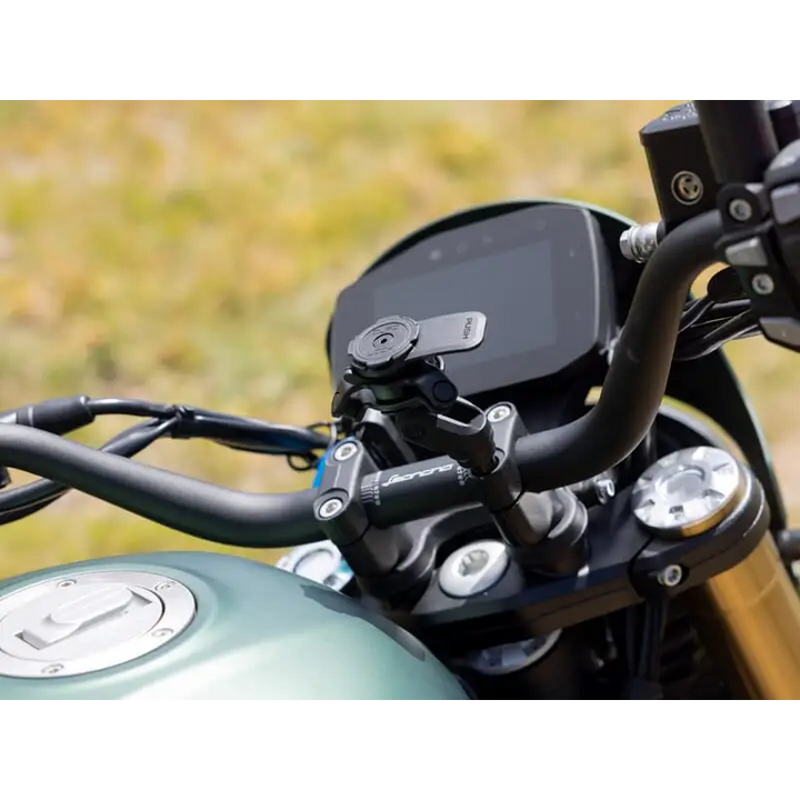 Motorcycle handlebar with Quad Lock Handlebar Clamp Mount Pro phone holder