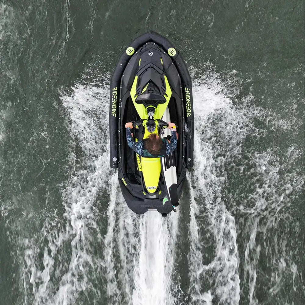 Vibrant yellow and black sea-doo rxt-x personal watercraft featuring ride engine base pwc collar plus speeding across the water