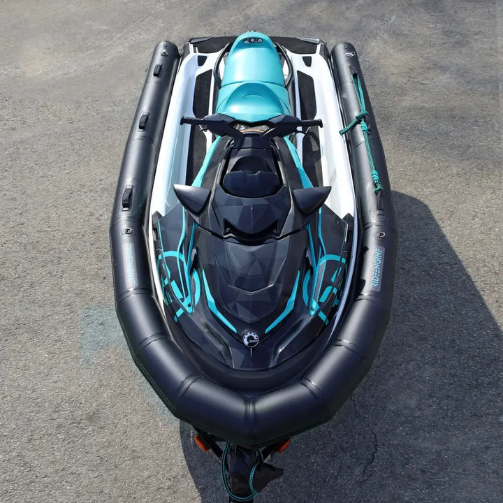 A sleek black and teal ride engine base pwc collar plus jet ski with glossy angular geometric patterns on its body