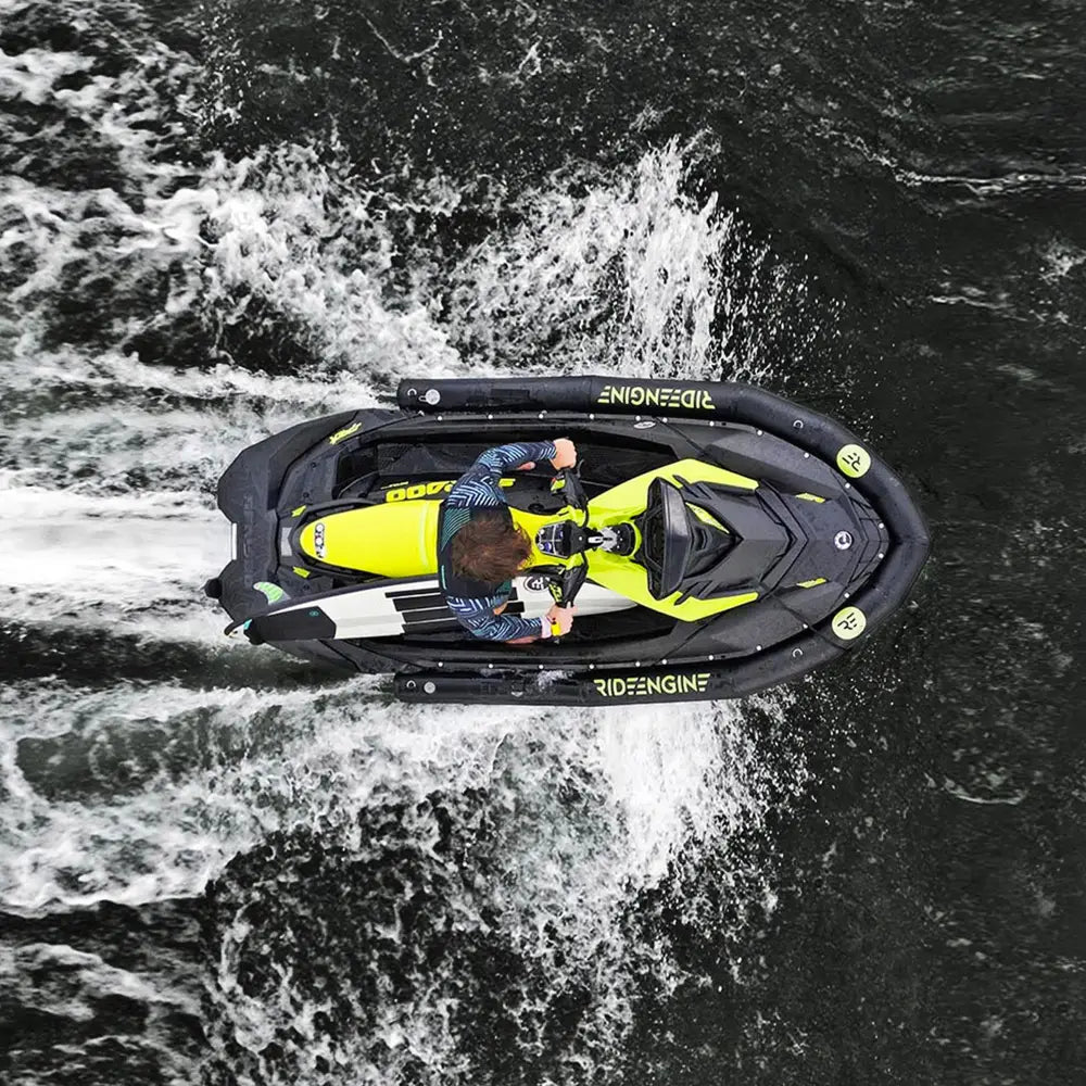 Vibrant yellow and black sea-doo with pro collar plus speeding through choppy waters for commercial use