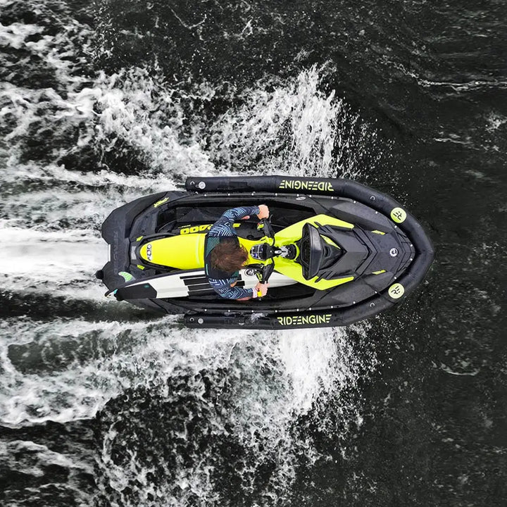 Vibrant yellow and black sea-doo with pro collar plus speeding through choppy waters for commercial use