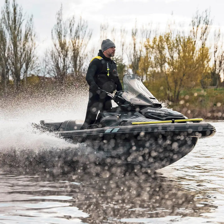 Black and yellow sea-doo personal watercraft with transparent windshield featuring ride engine pro collar plus
