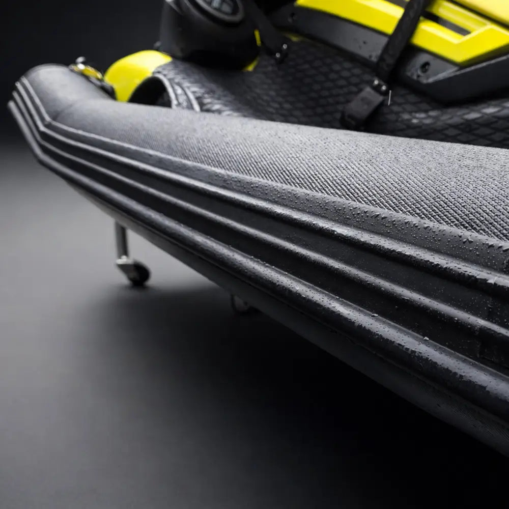 Black textured rubber side panel with ribbed grooves and matte finish on ride engine pwc pro collar plus commercial